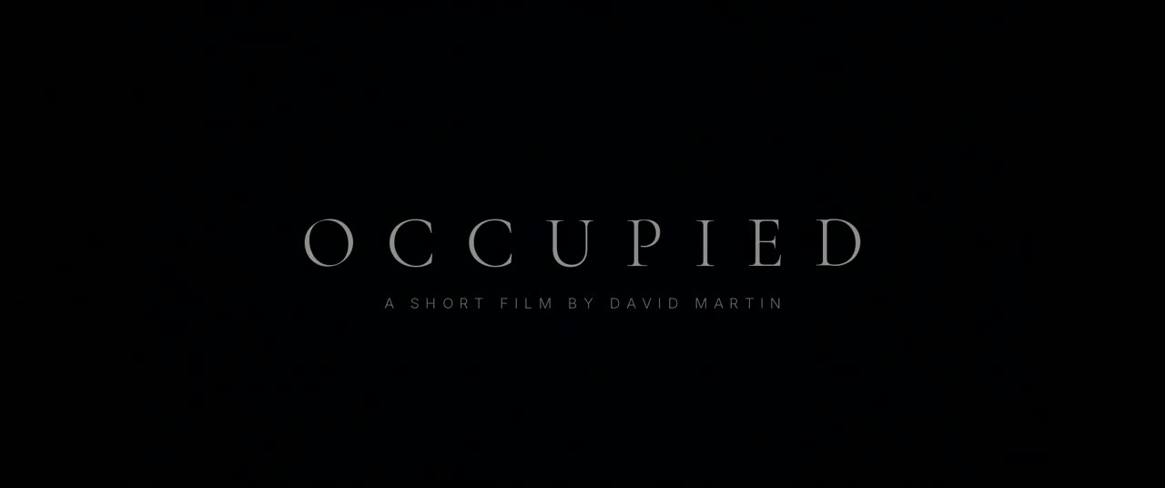 Title card: OCCUPIED in thin cream serif capitals on black